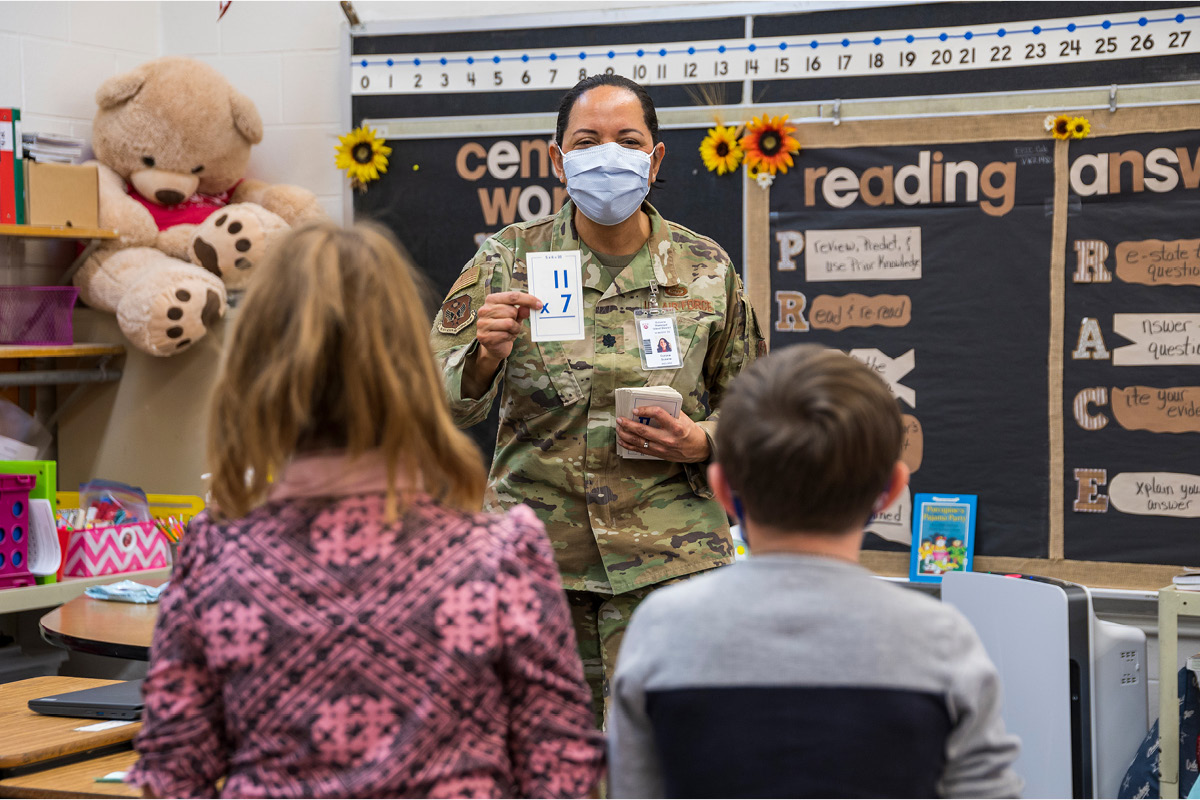 Lt. Col. Susana Corona, a member of the National Guard, holds up a flashcard in a classroom at Estancia Elementary School. Corona volunteered to serve as a substitute teacher amid widespread educator shortages across New Mexico. New Mexico National Guard photo by Iain Jaramillo
